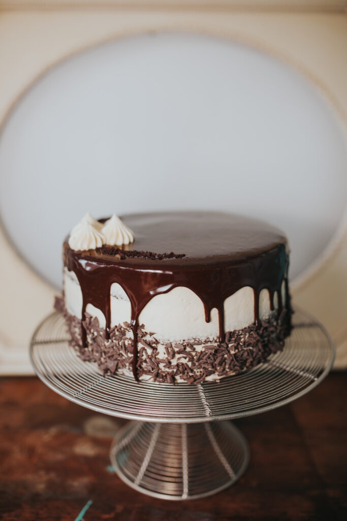 Chocolate Drip Buttercream Cake Chocolate drip cake with white buttercream and cream swirls