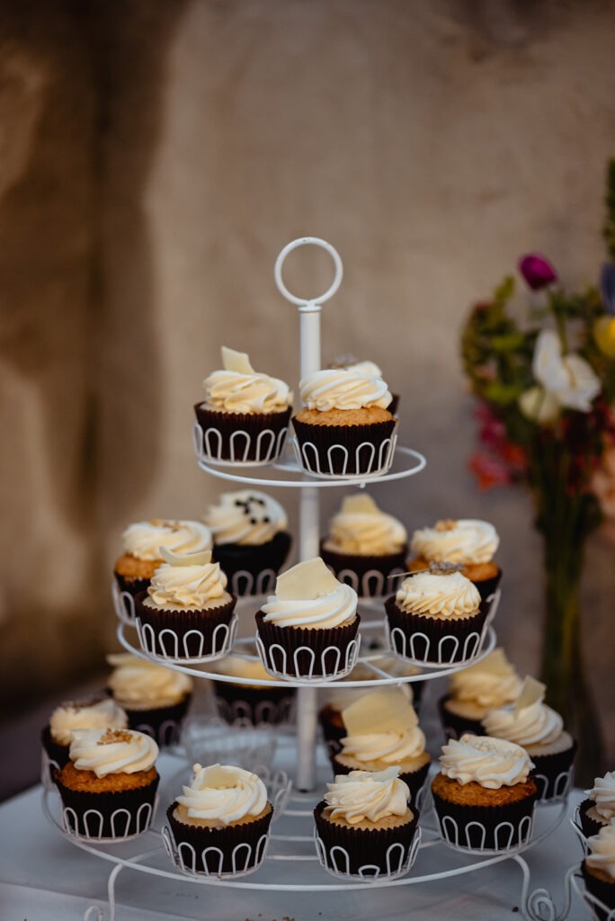 Chocolate Cupcakes on Tiered Stand Chocolate cupcakes with buttercream swirls on a tiered stand