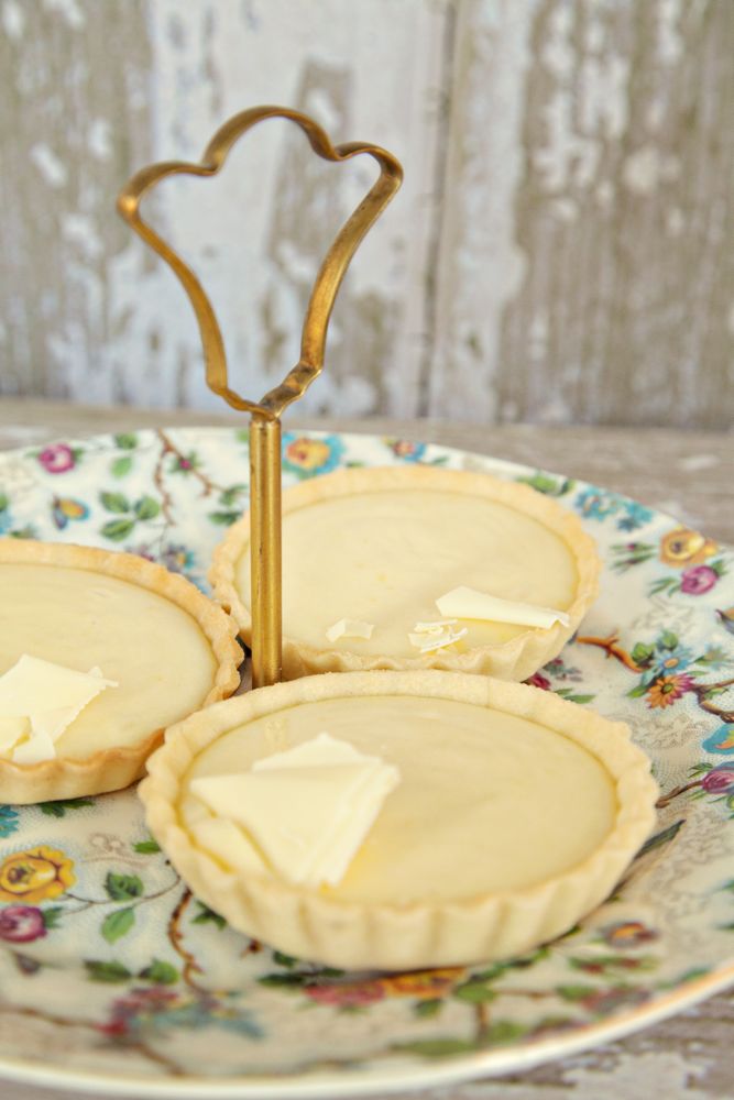 Lemon Tarts Lemon tarts on a vintage tiered stand and floral plates